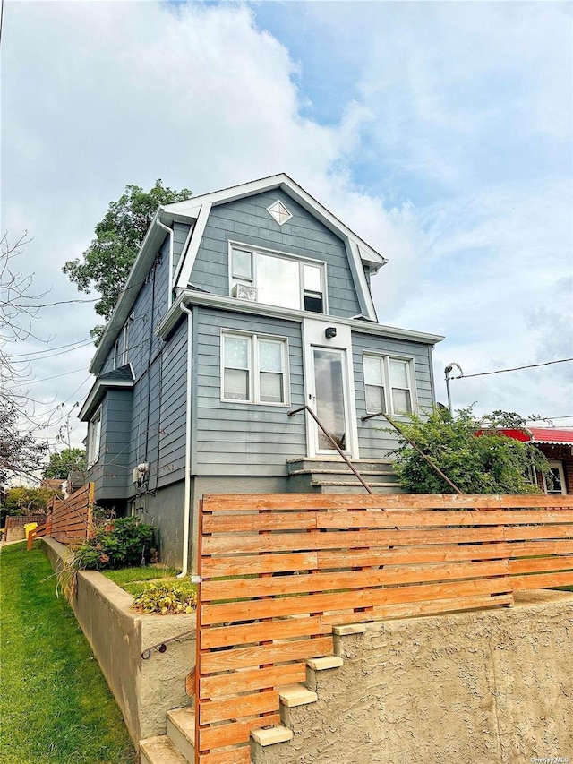 9-01 127th St, College Point, NY 11356 - colonial inspired home featuring entry steps and a gambrel roof