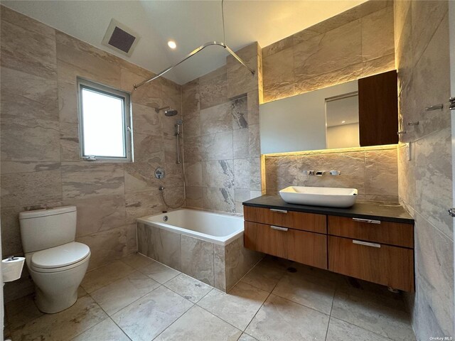 9-01 127th St, College Point, NY 11356 - full bathroom with tile walls, tiled shower / bath combo, vanity, and toilet