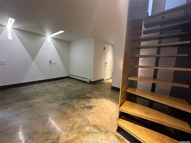 9-01 127th St, College Point, NY 11356 - staircase featuring baseboard heating, unfinished concrete floors, and baseboards