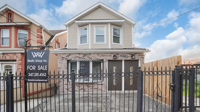 3919 Murdock Ave, Bronx, NY 10466 - view of front of property featuring brick siding, a gate, and a fenced front yard