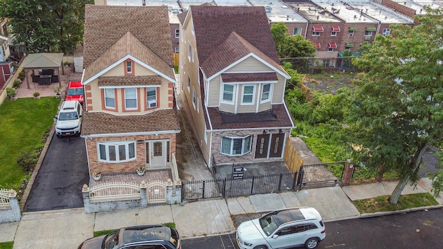 3919 Murdock Ave, Bronx, NY 10466 - view of front facade featuring a gate, a fenced front yard, uncovered parking, and brick siding
