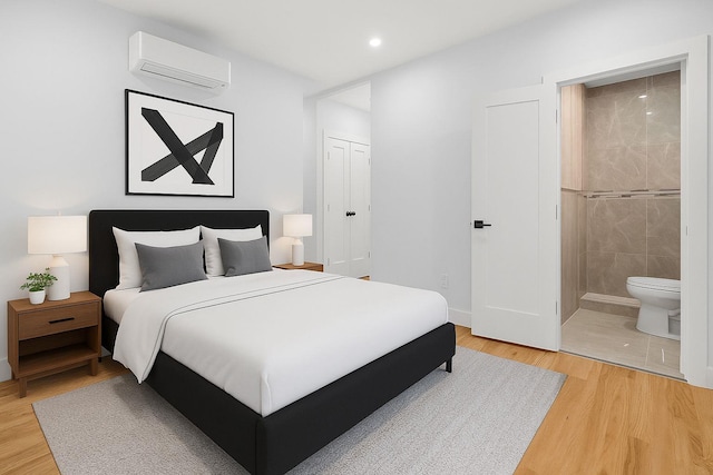3919 Murdock Ave, Bronx, NY 10466 - bedroom featuring a wall mounted AC, light wood finished floors, ensuite bath, and recessed lighting