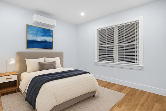 3919 Murdock Ave, Bronx, NY 10466 - bedroom featuring a wall mounted air conditioner, light wood finished floors, and recessed lighting