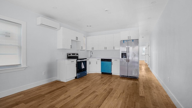 3919 Murdock Ave, Bronx, NY 10466 - kitchen with appliances with stainless steel finishes, a wall mounted air conditioner, light countertops, light wood finished floors, and white cabinets