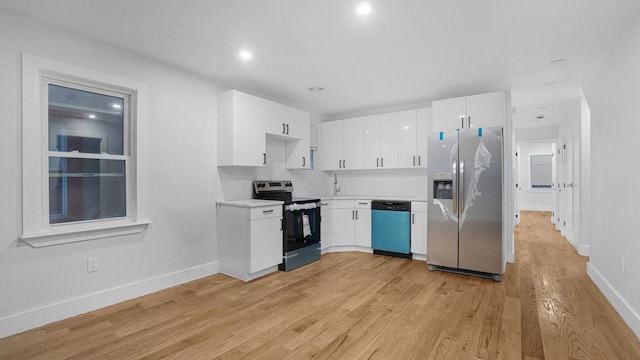 3919 Murdock Ave, Bronx, NY 10466 - kitchen with appliances with stainless steel finishes, light countertops, white cabinets, light wood-style flooring, and recessed lighting