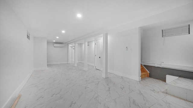 3919 Murdock Ave, Bronx, NY 10466 - finished below grade area featuring recessed lighting, a wall mounted AC, and light marble finish flooring