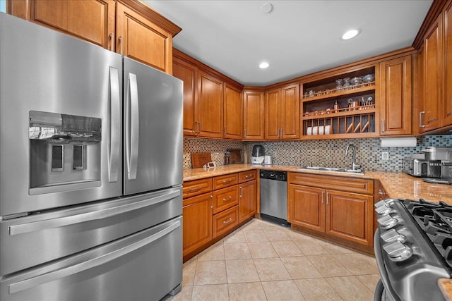 435 E Broadway Unit A, Long Beach, NY 11561 - kitchen with stainless steel appliances, open shelves, brown cabinetry, light tile patterned floors, and recessed lighting