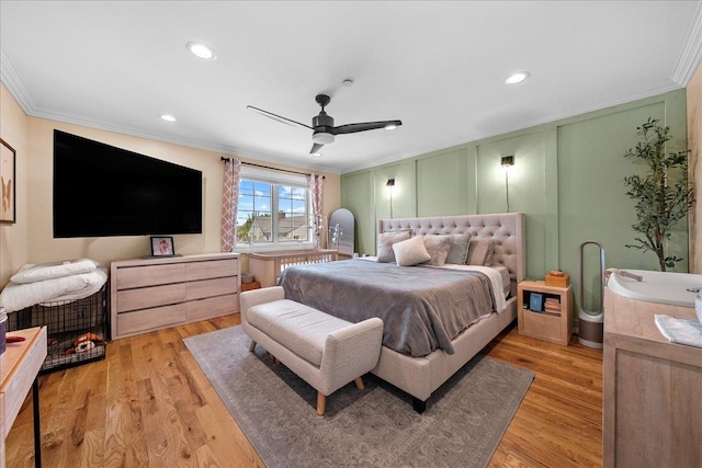 435 E Broadway Unit A, Long Beach, NY 11561 - bedroom featuring ornamental molding, light wood-type flooring, a decorative wall, recessed lighting, and a ceiling fan