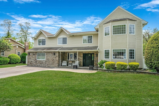 33 Stonywood Dr, Commack, NY 11725 - view of front of house with a front yard and stone siding