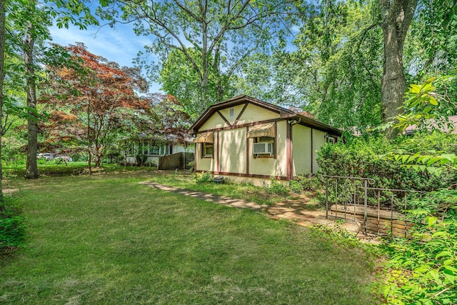 114 Oakwood Dr, Wading River, NY 11792 - view of side of home with a lawn and cooling unit