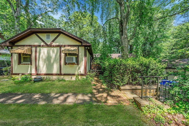 114 Oakwood Dr, Wading River, NY 11792 - view of property exterior with cooling unit and a yard