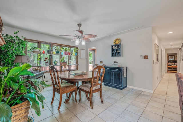 114 Oakwood Dr, Wading River, NY 11792 - dining room featuring ceiling fan, light tile patterned floors, and baseboards