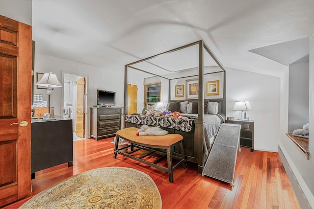 114 Oakwood Dr, Wading River, NY 11792 - bedroom with hardwood / wood-style floors, baseboards, and ensuite bathroom