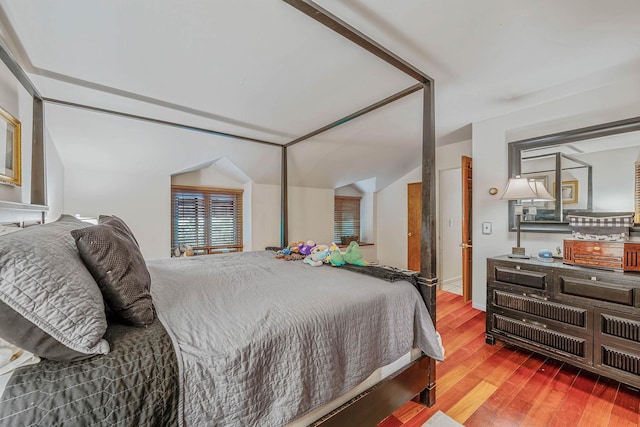 114 Oakwood Dr, Wading River, NY 11792 - bedroom with wood finished floors and lofted ceiling