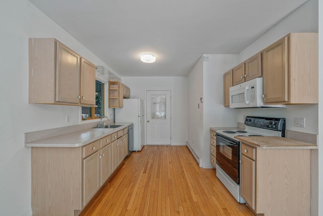 114 Oakwood Dr, Wading River, NY 11792 - kitchen with electric stove, white microwave, a sink, dishwasher, and baseboard heating