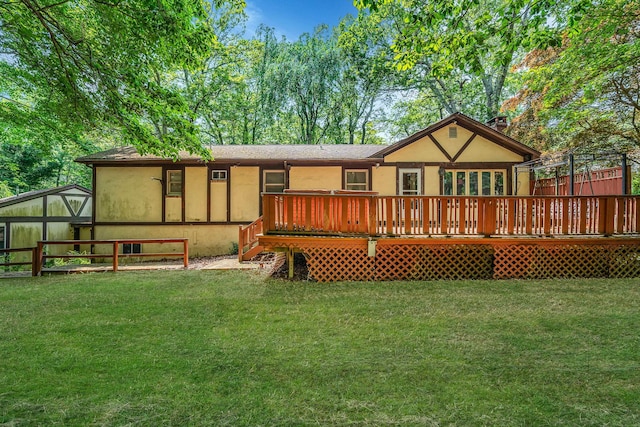 114 Oakwood Dr, Wading River, NY 11792 - back of property with a deck and stucco siding