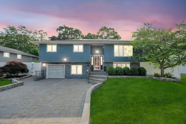 15 Fairway Dr, Old Bethpage, NY 11804 - bi-level home featuring decorative driveway, a garage, and a gate