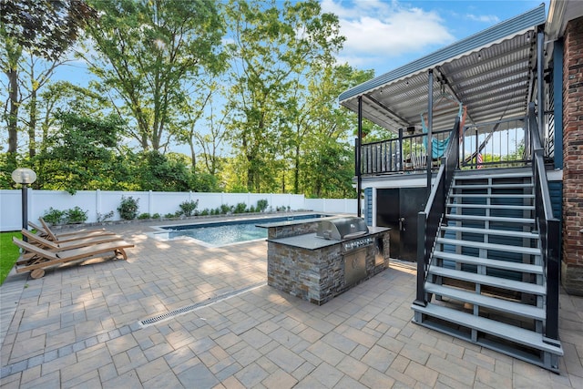 15 Fairway Dr, Old Bethpage, NY 11804 - view of swimming pool with stairs, a fenced backyard, a patio area, and exterior kitchen