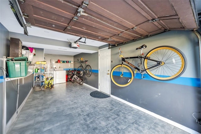 15 Fairway Dr, Old Bethpage, NY 11804 - garage featuring washing machine and clothes dryer and a garage door opener