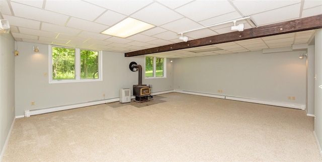 23 Wild Turkey Run, Wappingers Falls, NY 12590 - basement with a baseboard heating unit, a wood stove, carpet, and a baseboard radiator