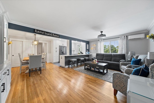 200 Merrick Rd Unit R, Amityville, NY 11701 - living area with a wall mounted air conditioner, crown molding, and light wood finished floors
