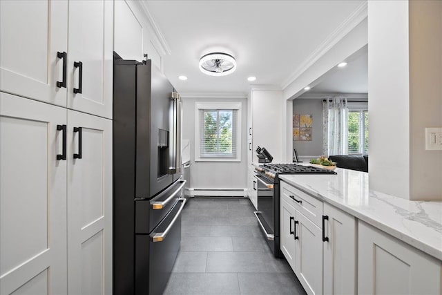 200 Merrick Rd Unit R, Amityville, NY 11701 - kitchen with stainless steel appliances, a baseboard heating unit, crown molding, white cabinetry, and light stone countertops