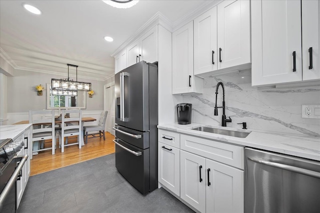 200 Merrick Rd Unit R, Amityville, NY 11701 - kitchen with appliances with stainless steel finishes, a sink, white cabinetry, recessed lighting, and tasteful backsplash
