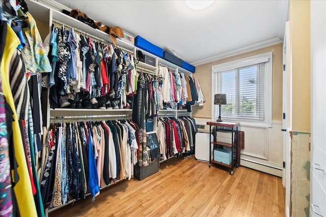 200 Merrick Rd Unit R, Amityville, NY 11701 - spacious closet featuring wood finished floors and a baseboard heating unit