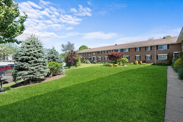 200 Merrick Rd Unit R, Amityville, NY 11701 - view of home's community featuring a lawn