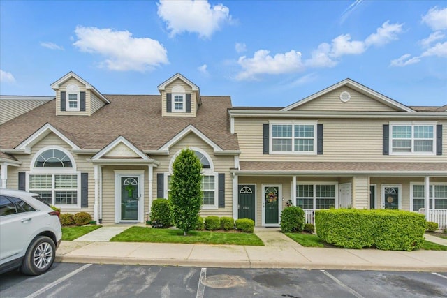 1512 Willow Ln, Valley Stream, NY 11580 - view of property with roof with shingles and uncovered parking