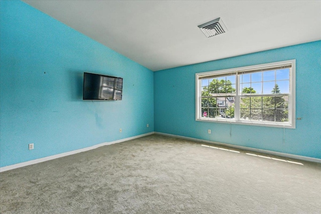 1512 Willow Ln, Valley Stream, NY 11580 - spare room with vaulted ceiling, carpet flooring, and baseboards
