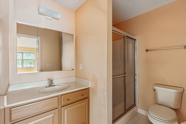1512 Willow Ln, Valley Stream, NY 11580 - bathroom featuring vanity, toilet, a stall shower, and tile patterned flooring