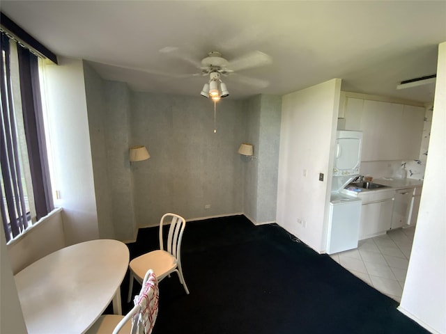 27110 Grand Central Pkwy Unit 11A, Floral Park, NY 11005 - dining room with stacked washing machine and dryer, ceiling fan, and light tile patterned flooring