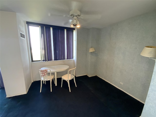 27110 Grand Central Pkwy Unit 11A, Floral Park, NY 11005 - dining room featuring a ceiling fan and dark colored carpet
