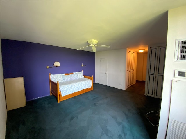 27110 Grand Central Pkwy Unit 11A, Floral Park, NY 11005 - unfurnished bedroom featuring dark colored carpet and a ceiling fan
