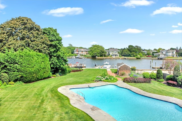 161 Wampum Ln, West Islip, NY 11795 - view of swimming pool featuring a water view, a yard, and a dock