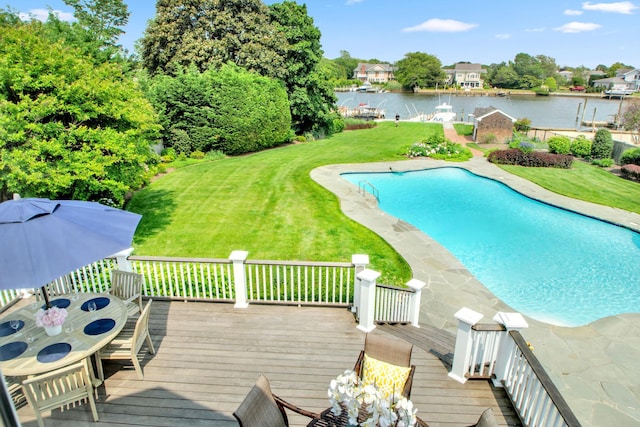 161 Wampum Ln, West Islip, NY 11795 - view of swimming pool featuring a deck with water view, a lawn, and outdoor dining space