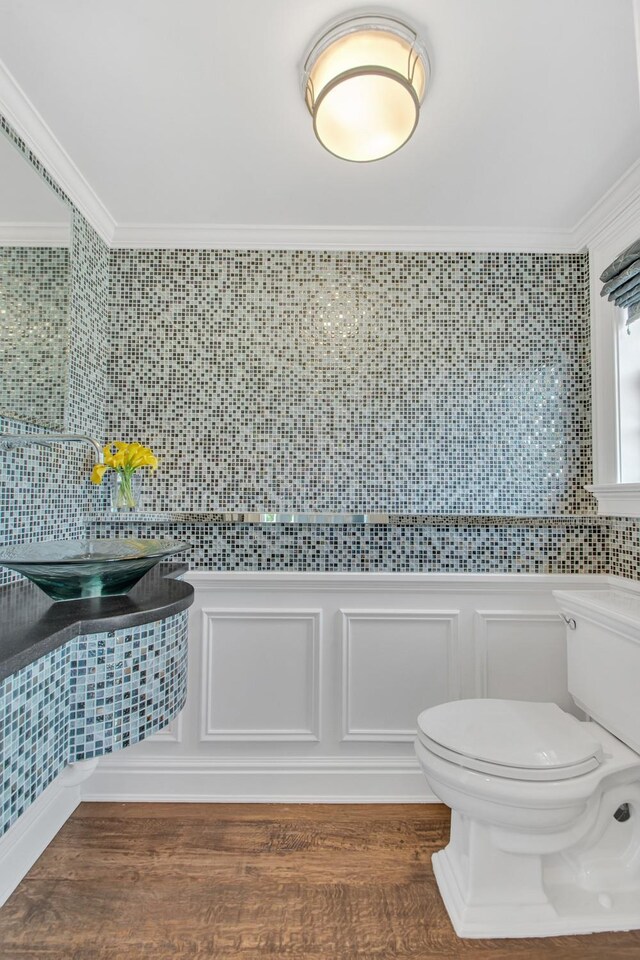 161 Wampum Ln, West Islip, NY 11795 - bathroom with toilet, ornamental molding, and wood finished floors