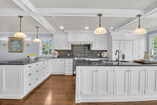 161 Wampum Ln, West Islip, NY 11795 - kitchen featuring high end stainless steel range oven, dark countertops, ornamental molding, a sink, and beam ceiling