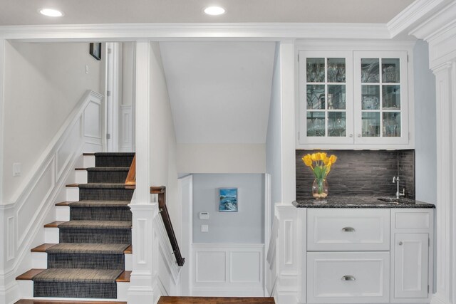 161 Wampum Ln, West Islip, NY 11795 - stairway with a decorative wall, wet bar, crown molding, wainscoting, and recessed lighting