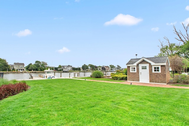 161 Wampum Ln, West Islip, NY 11795 - view of grassy yard featuring a boat dock, a water view, and an outdoor structure