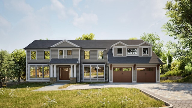 32 Sycamore Rd, Scarsdale, NY 10583 - view of front of property with decorative driveway, a front lawn, and an attached garage