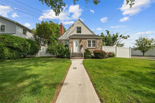 1779 Aladdin Ave, New Hyde Park, NY 11040 - view of front of home with stone siding and a chimney
