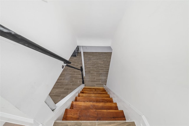 1779 Aladdin Ave, New Hyde Park, NY 11040 - staircase with baseboards and wood finished floors