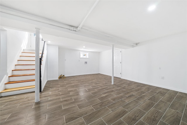 1779 Aladdin Ave, New Hyde Park, NY 11040 - basement with dark wood-style flooring, stairs, baseboards, and recessed lighting
