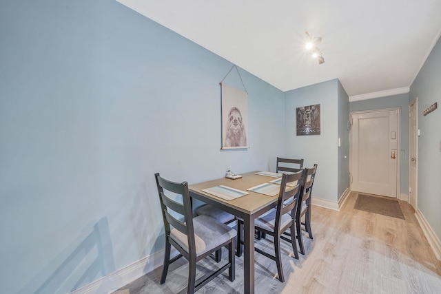 23 Edwards St Unit 1C, Roslyn Heights, NY 11577 - dining room with baseboards and light wood-style flooring