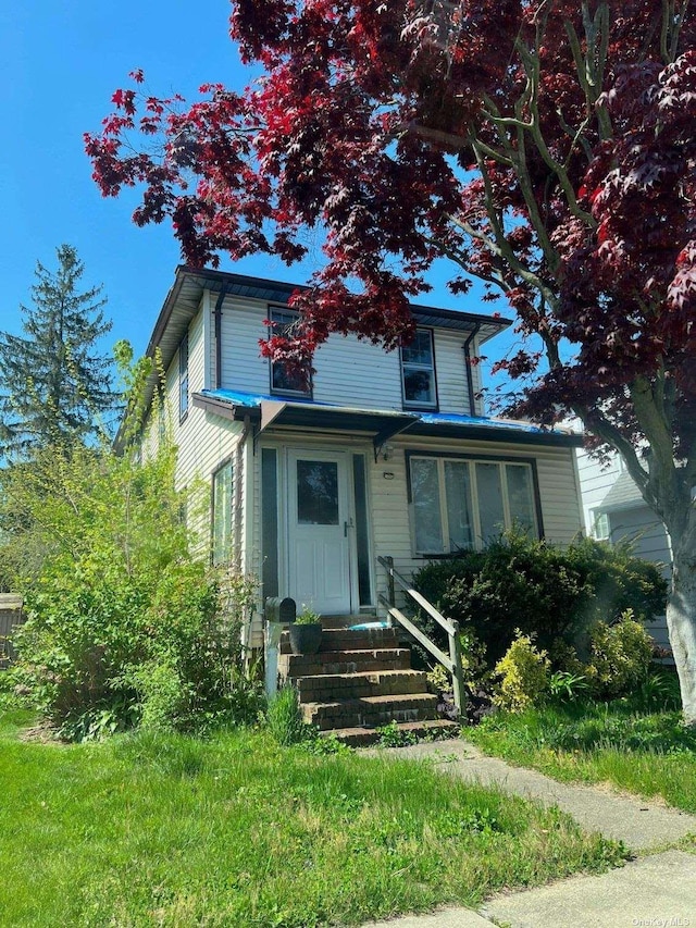 124 Raymond St, Rockville Centre, NY 11570 - view of front of house featuring entry steps