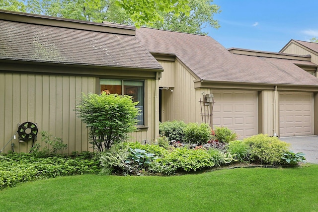 963 Heritage Hls Unit C, Somers, NY 10589 - view of front facade with a garage, driveway, a front lawn, and a shingled roof