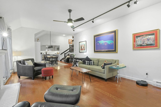 963 Heritage Hls Unit C, Somers, NY 10589 - living area with track lighting, stairway, ceiling fan, wood finished floors, and vaulted ceiling