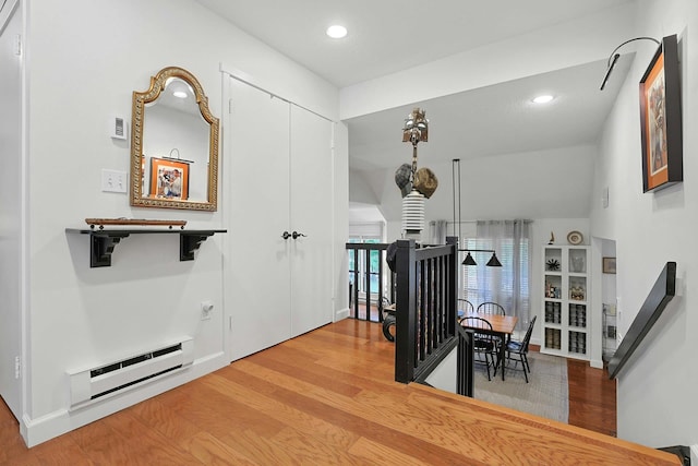 963 Heritage Hls Unit C, Somers, NY 10589 - corridor with wood finished floors, baseboard heating, an upstairs landing, and recessed lighting